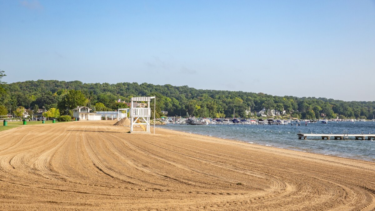 Geneva Lake beach and swimming pier on a clear morning