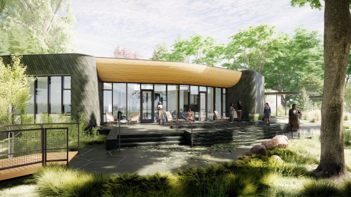 Architectural rendering of the Women's Leadership Center building among the trees
